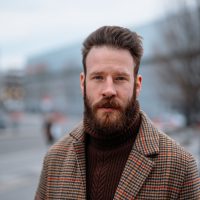 vecteezy_business-portrait-of-standing-man-in-outdoor-looking-to-camera_7189771